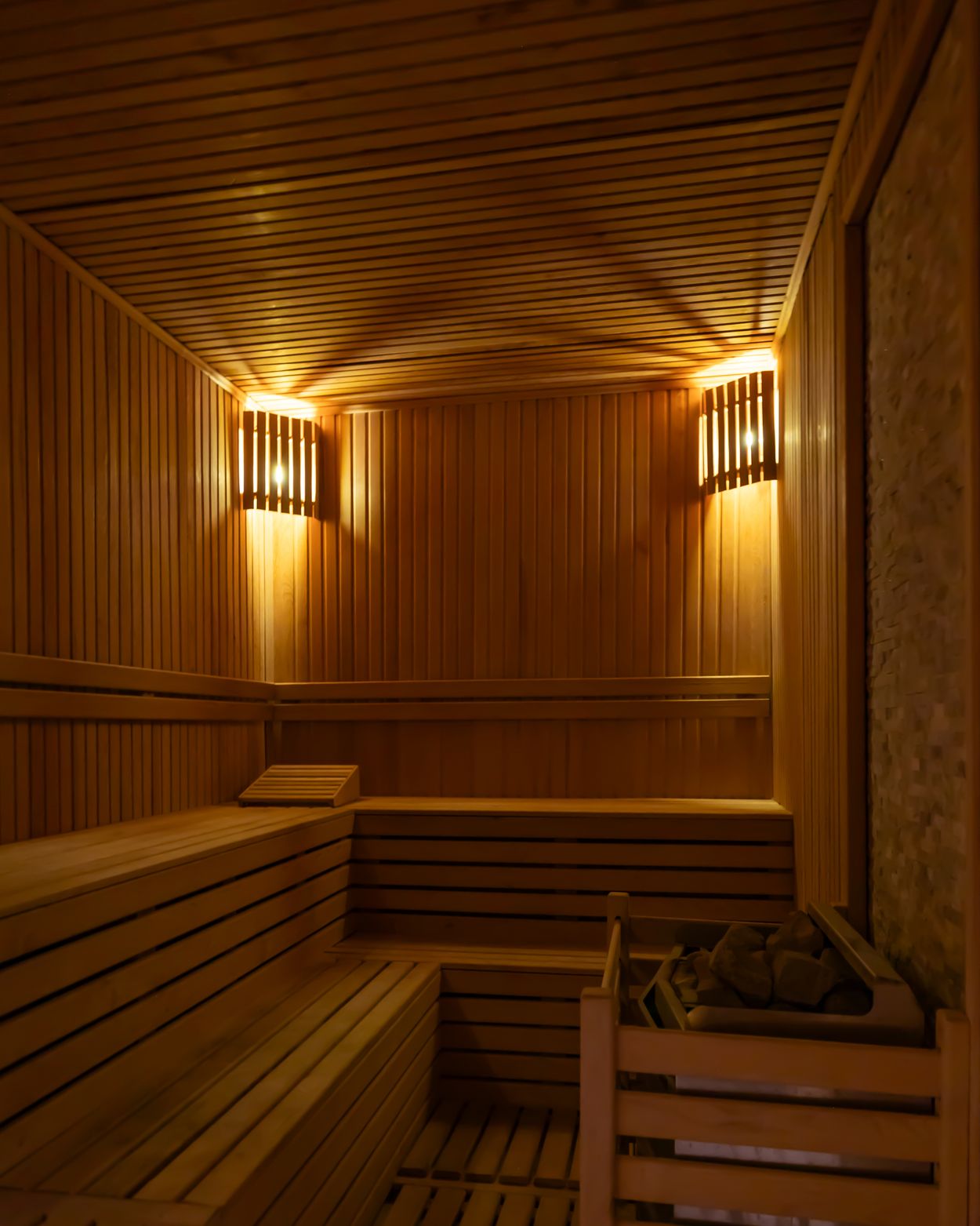 Quiet wooden sauna with ambient lighting (editorial stock photography)